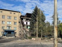 Зруйнований окупантами багатоповерховий будинок