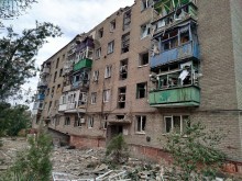 Зруйнований окупантами багатоповерховий будинок