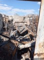 Гараж та згорілий автомобіль після обстрілу окупантів.
