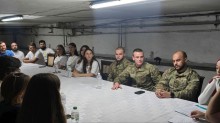 Представники молодіжних рад та обласних адміністрацій. Сидять за столом.Захід відбувся в укритті.