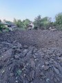 Вирва від російської міни на городі.