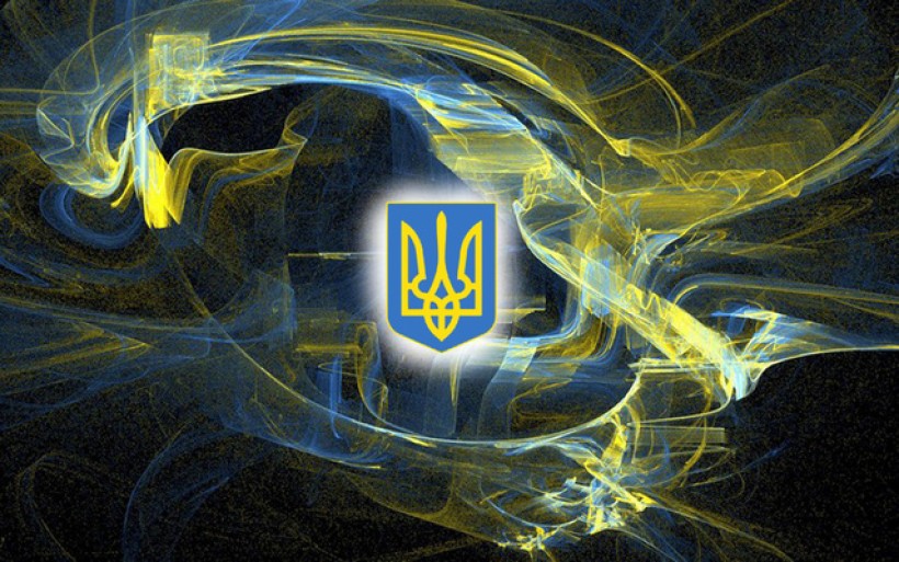 Герб України на фоні абстракції у жовтих та синіх кольорах